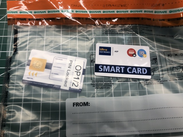 Reading a smart card through a tamper evident bag